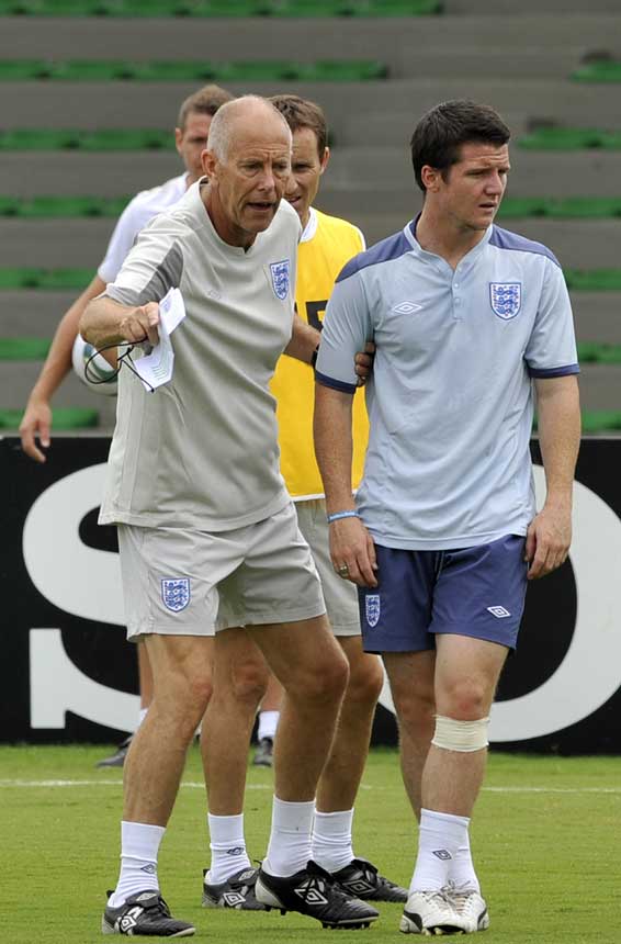 Brian Eastick instructs Billy Knott during a training session.